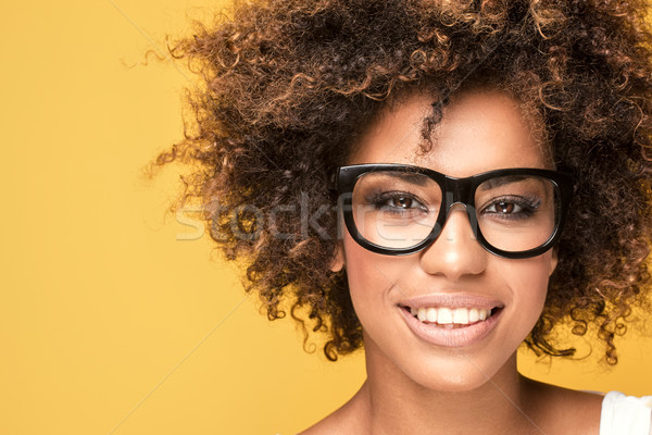 African american girl wearing eyeglasses,smiling. Stock photo © NeonShot