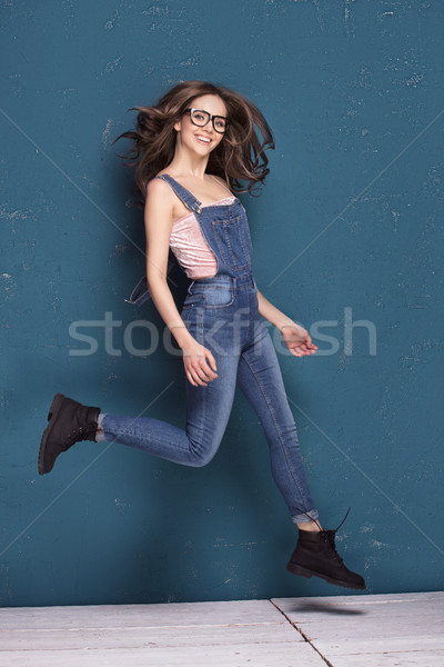 Young natural female model jumping, smiling. Stock photo © NeonShot