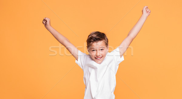 Weinig jongen springen studio glimlachend schooljongen Stockfoto © NeonShot