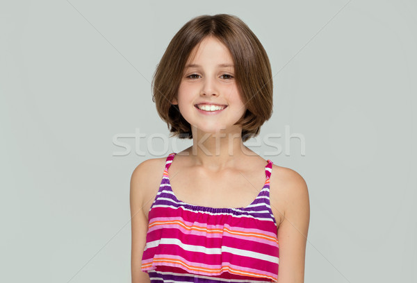 Stock photo: Young girl posing in fashionable dress.