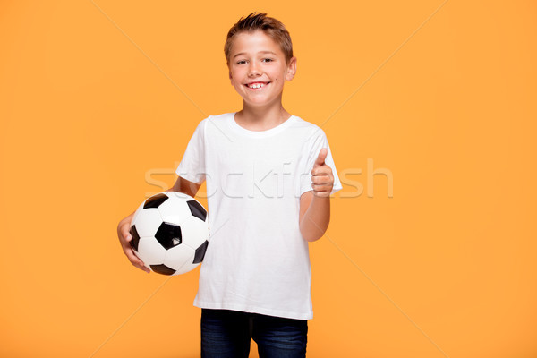 Stockfoto: Gelukkig · weinig · jongen · voetbal · speler · houden