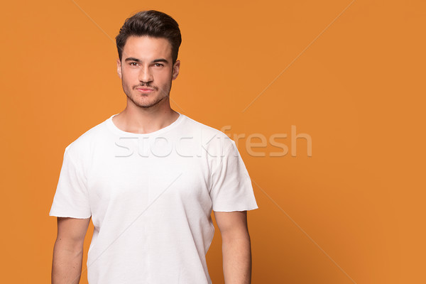 Fotografia przystojny młody człowiek biały tshirt Zdjęcia stock © NeonShot