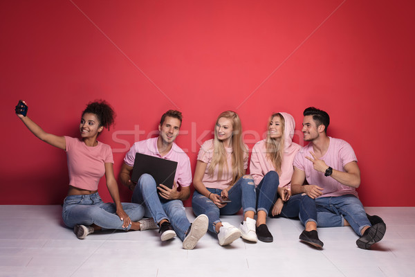 Genç insanlar bakıyor oturma zemin Stok fotoğraf © NeonShot