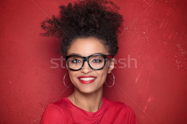 Portré szépség afro lány mosoly fogakkal mosolyog Stock fotó © NeonShot
