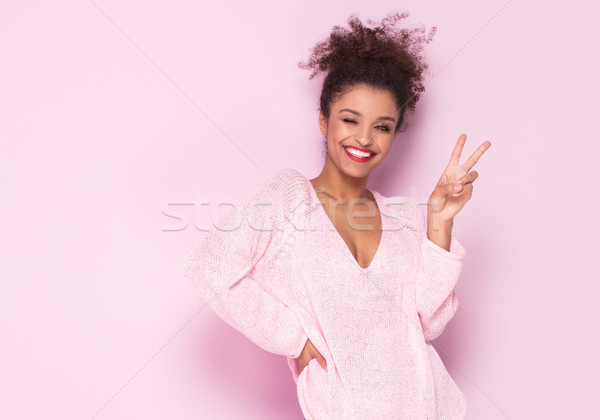Happy afro girl with amazing smile posing on pink background. Stock photo © NeonShot