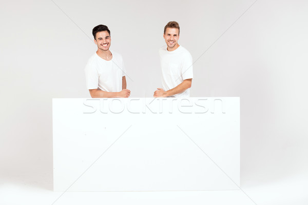 Twee jongens poseren witte lege boord Stockfoto © NeonShot