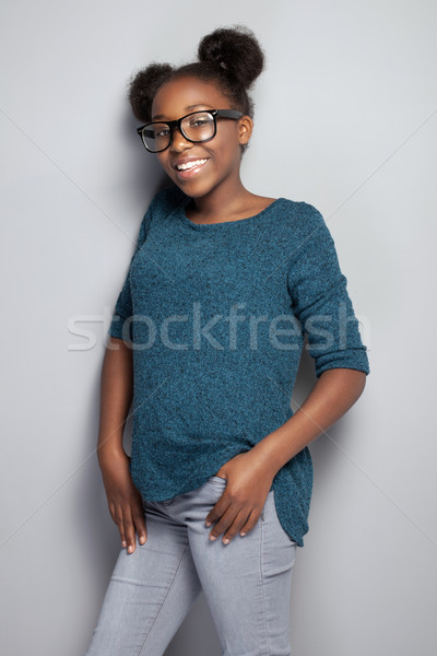 Happy young girl in eyeglasses. Stock photo © NeonShot