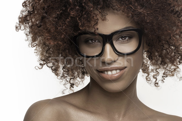 Beautiful girl with afro wearing eyeglasses. Stock photo © NeonShot
