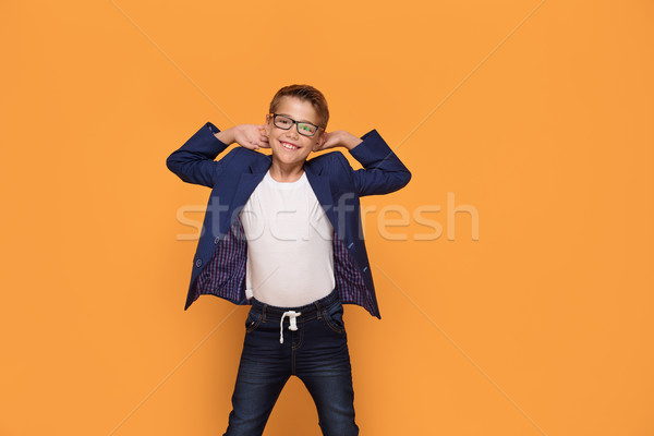 Smiling young elegant boy in eyeglasses. Stock photo © NeonShot