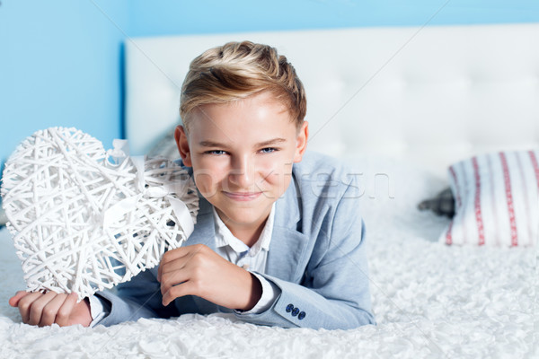 Young teenage boy with heart Stock photo © NeonShot