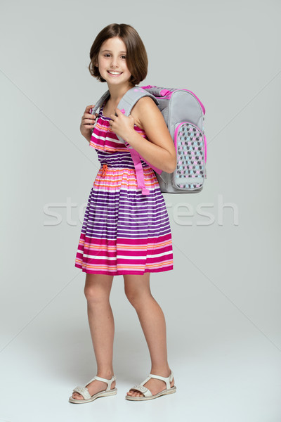 Stock photo: Young girl posing with school backpack.