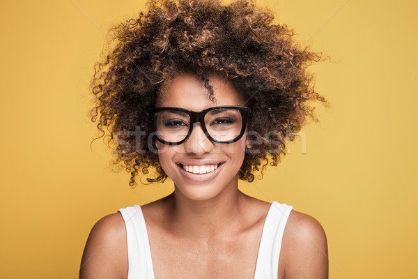 African american girl wearing eyeglasses,smiling. Stock photo © NeonShot
