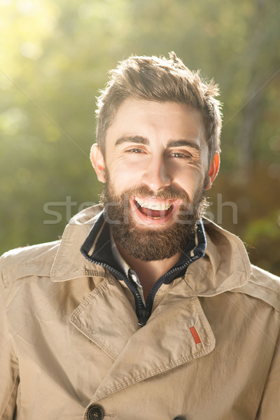 Smiling handsome young man outdoor. Stock photo © NeonShot