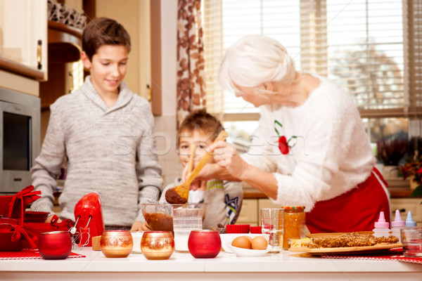 Grandmother with grandchilds in kitchen, christmas. Stock photo © NeonShot