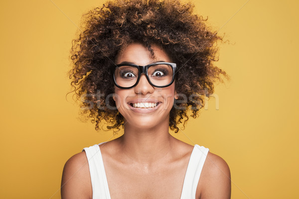 African american girl wearing eyeglasses,smiling. Stock photo © NeonShot