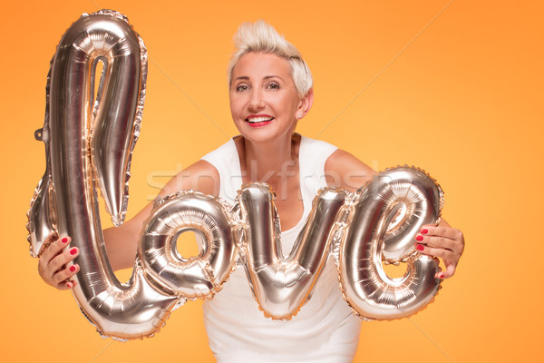 Attractive middle aged woman with love letters. Stock photo © NeonShot