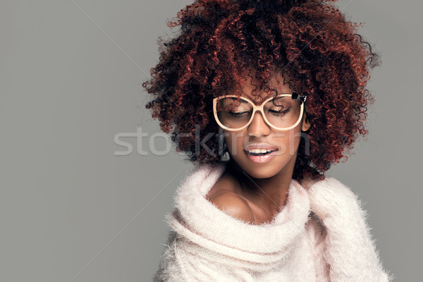 Happy woman with afro hairstyle smiling. Stock photo © NeonShot
