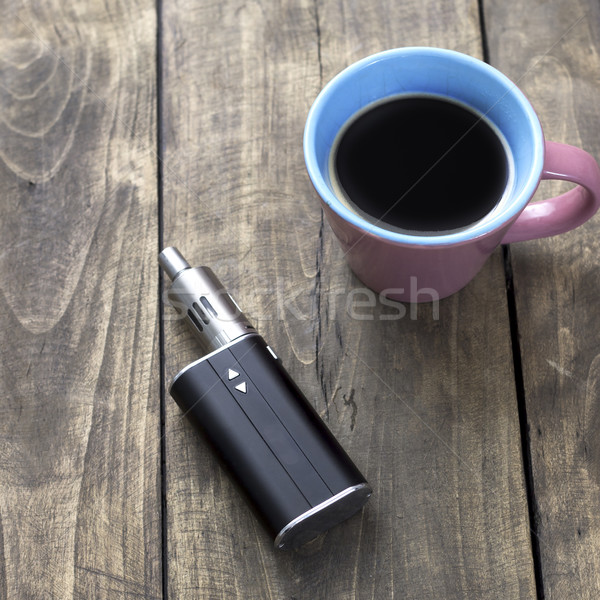 e-cigarette and cup of coffee Stock photo © nessokv