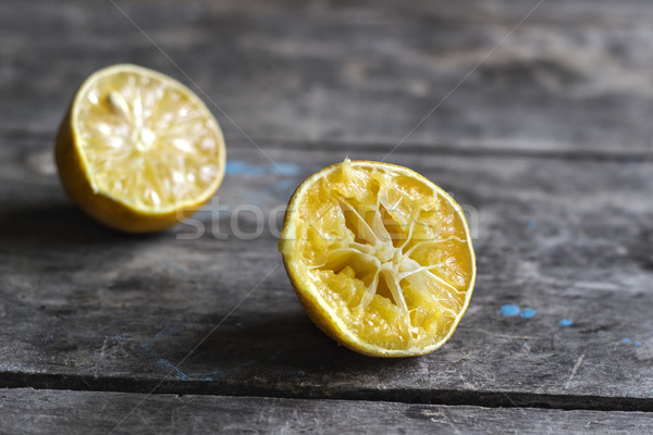 Withered Half Lemon on old wooden table Stock photo © nessokv