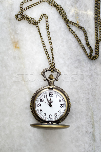 Pocket watch with  chain on marble. Stock photo © nessokv