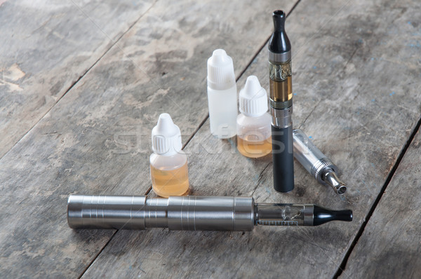electronic cigarette on old wooden table Stock photo © nessokv