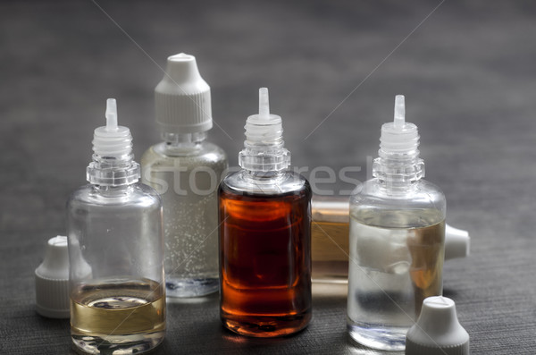 Stock photo: E cigarettes Liquid Bottle