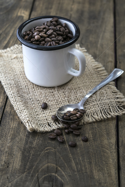 Coffee beans in an enamel mug. Stock photo © nessokv