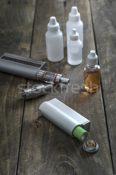 E-cigarettes with lots of different re-fill bottles Stock photo © nessokv