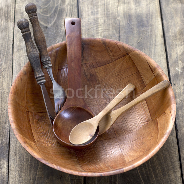 Wood kitchen utensils over wooden table background Stock photo © nessokv