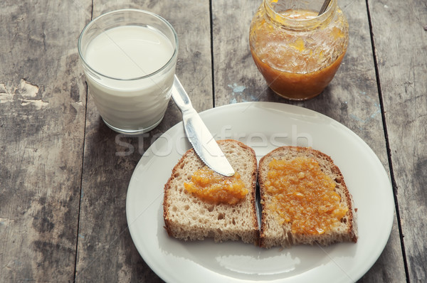 早餐 果醬 麵包 橙 玻璃 牛奶 商業照片 © nessokv