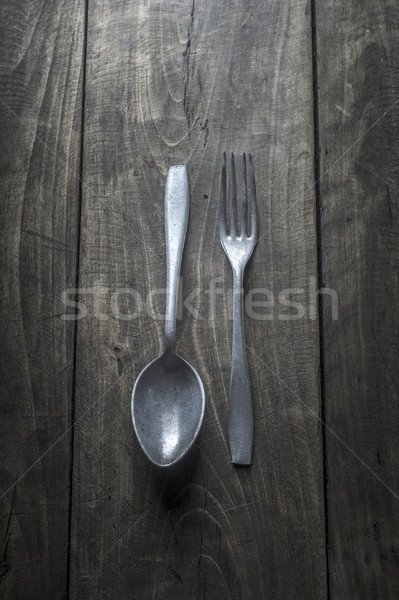 Old cutlery on wooden table Stock photo © nessokv