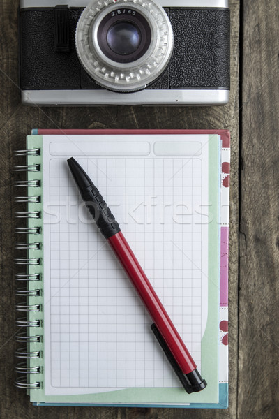 Blank notebook with  pen and retro camera on wooden table Stock photo © nessokv