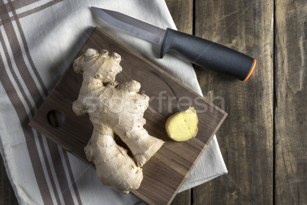 Fresh ginger root on a cutting board Stock photo © nessokv