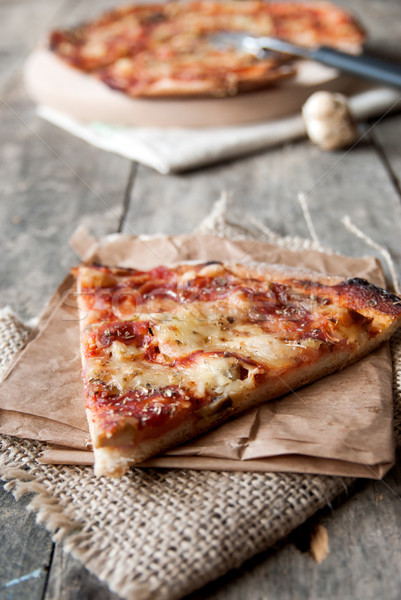 close up of homemade pizza on old wooden table,natural light Stock photo © nessokv