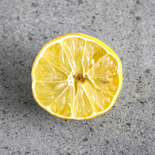Withered Half Lemon on old table Stock photo © nessokv