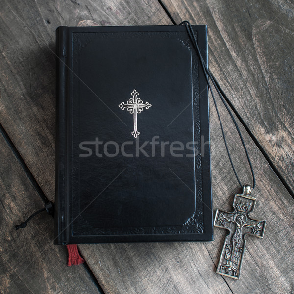 Christian cross necklace next to holy Bible Stock photo © nessokv