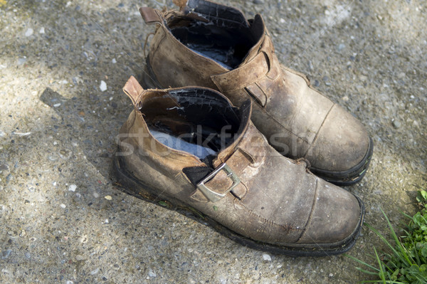 Weathered forgotten shoes Stock photo © nessokv