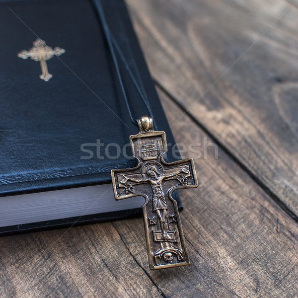 Christian cross necklace next to holy Bible Stock photo © nessokv
