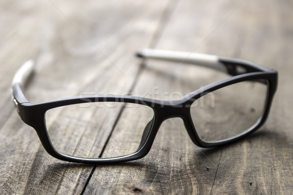Optical glasses on wooden background Stock photo © nessokv