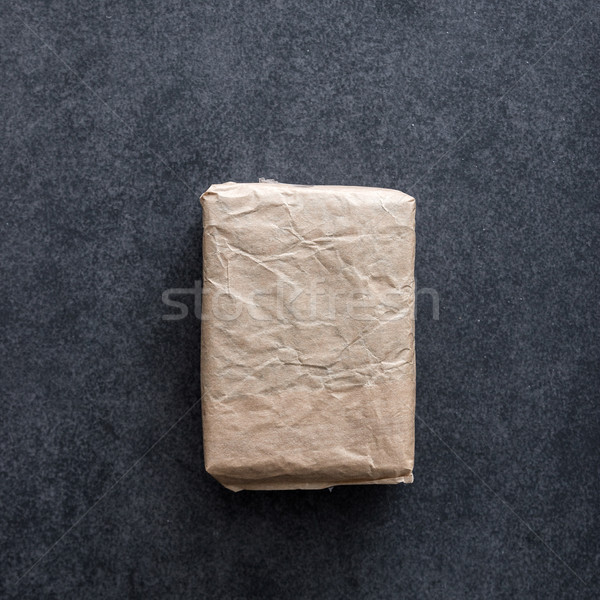 Package wrapped in wrinkled brown paper Stock photo © nessokv