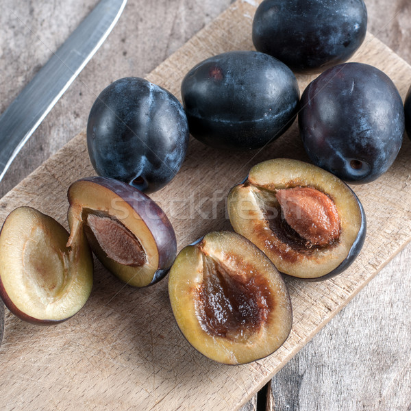 plums on a wooden kitchen board Stock photo © nessokv