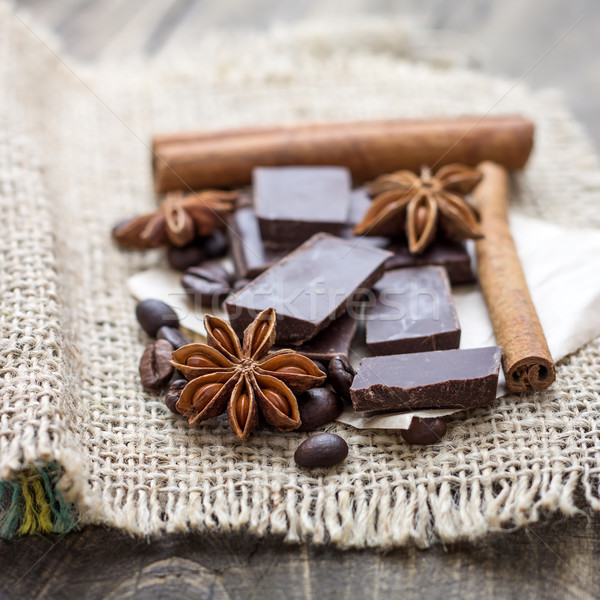 Stock photo: Chocolate crumbs, star anise and cinnamon sticks.
