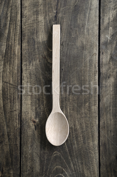 Stock photo: Old rustic wooden spoon - overhead view