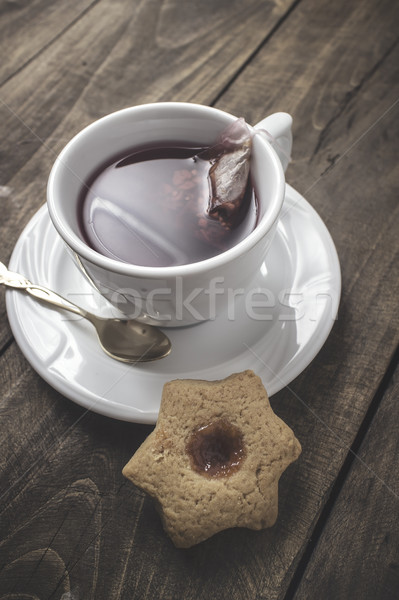 Fresh cookie with fruit jelly and tea cup  Stock photo © nessokv