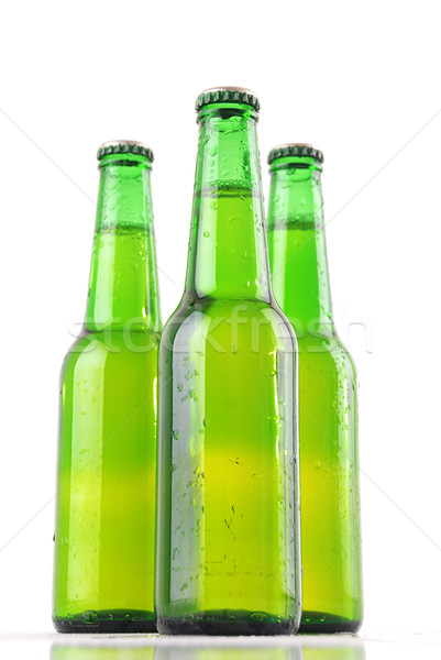 Cerveza botellas tres gotas de agua blanco textura Foto stock © nezezon