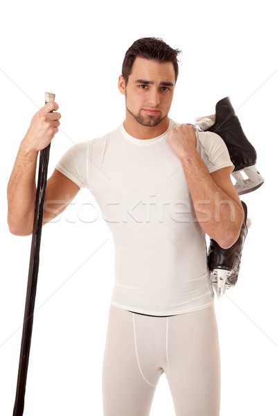 Athletic young man with ice hockey equipment. Stock photo © nickp37