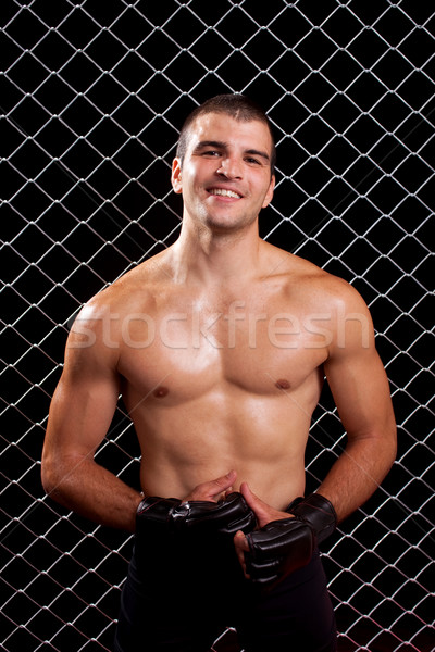 Mixed martial artist posed in front of chain link Stock photo © nickp37