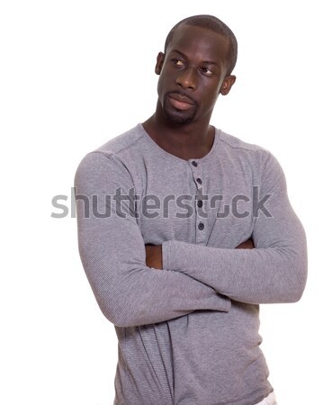 Man in grey shirt and white pants. Studio shot over white. Stock photo © nickp37