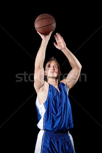 Male basketball player. Studio shot over black. Stock photo © nickp37