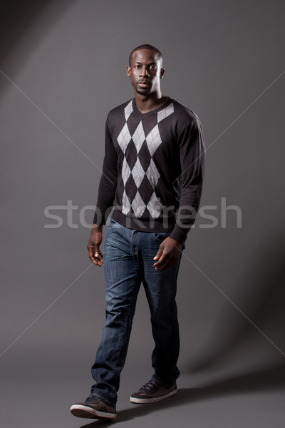 Casual male model. Studio shot over grey. Stock photo © nickp37